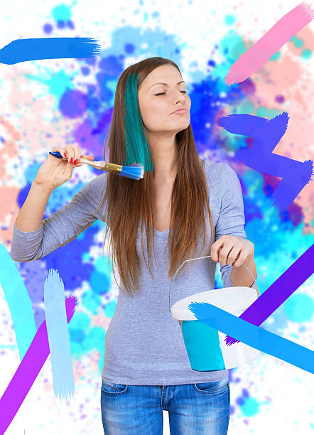 istock Girl painting all around 476834376