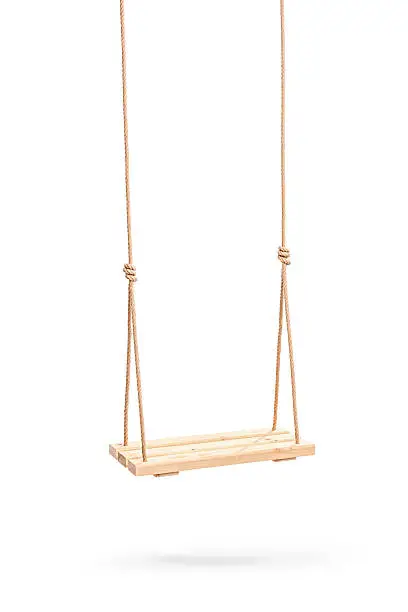 Photo of Wwooden swing hanging on a couple of ropes