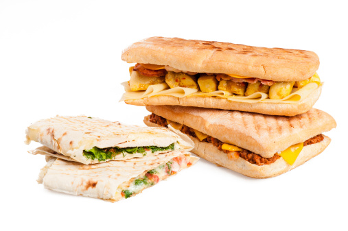 Pita sandwich with cheese and panini with meat isolated on white background