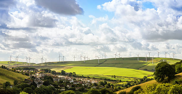 long range vista di turbine eoliche in campagna - ireland landscape foto e immagini stock