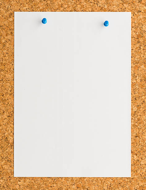 istock white paper with blue push pin on cork board 476836144