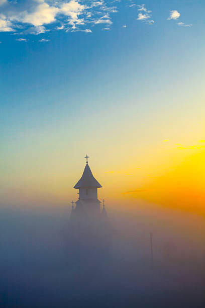istock Morning mist over the church 476836794