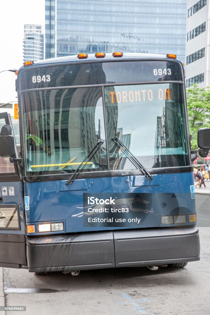 Blue Greyhound bus in motion Toronto, Canada - June 24, 2011: Blue Greyhound bus in motion in downtown Toronto street. People are visible through the windows Canada Stock Photo