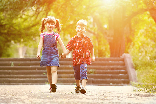 istock Happiness brother and sister fun outdoor under sunlight 476839848