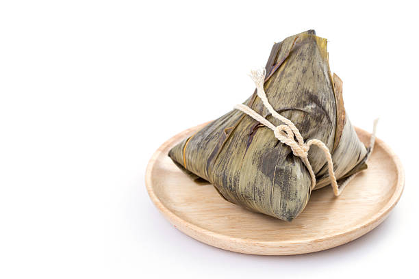 istock Zongzi or sticky rice dumpling on white background 476840254
