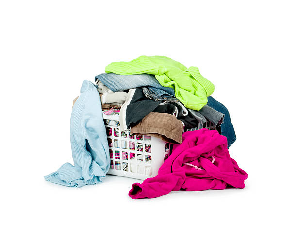 istock Bright clothes in a laundry basket on white background 476842106