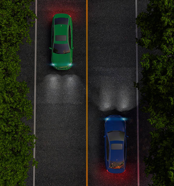 istock green and blue cars on road. night 476845954