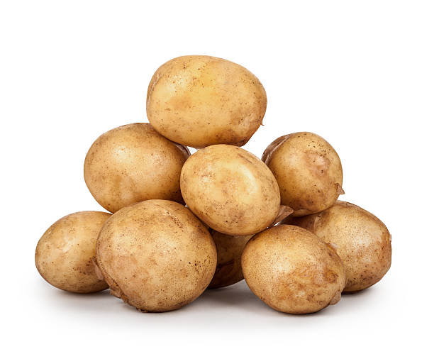 istock new potatoes big heap isolated on white background 476846046