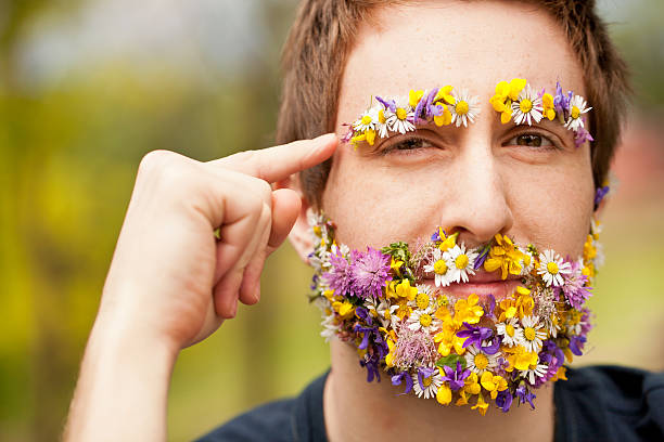 istock hipster face-covered with flowers thinking 476846630