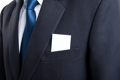 Close up with blank business card in business man suit jacket pocket