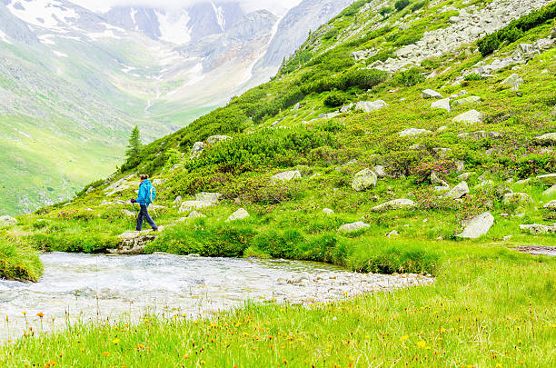 istock Young woman on a mountain trail, Alps, Austria 476851042