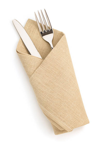 napkin, fork and knife isolated on white background