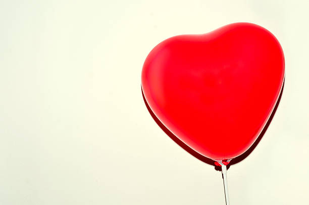 istock heart-shaped balloon against a white background 476852952