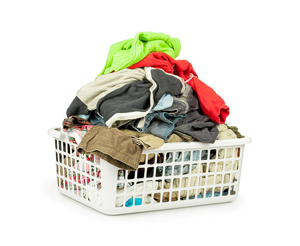 istock Bright clothes in a laundry basket on white background 476852984