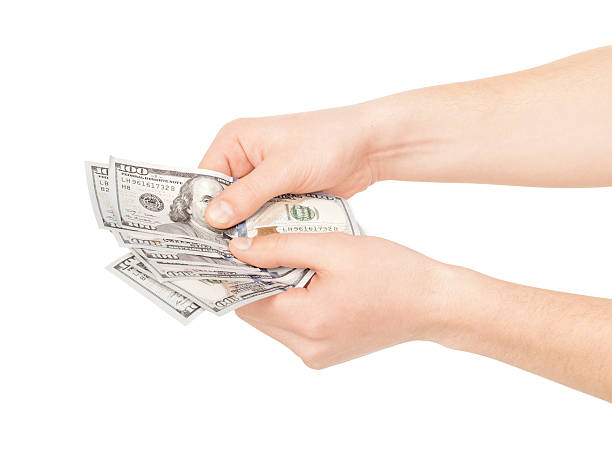istock Hands holding american dollar bills. Isolated on a white backgro 476853150