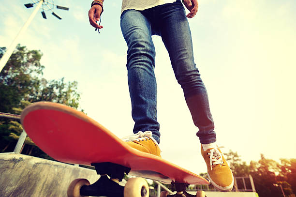 istock skateboarding legs sunrise skatepark 476857640