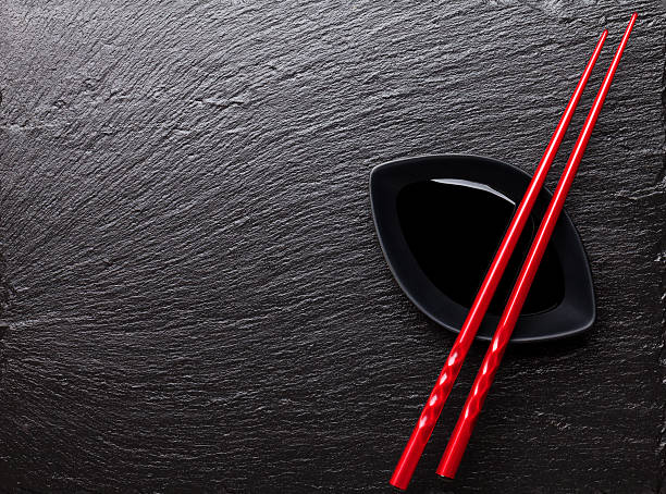 istock Japanese sushi chopsticks over soy sauce bowl 476858362