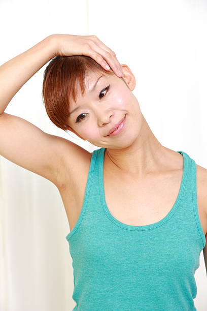 istock young japanese woman doing stretch 476859561