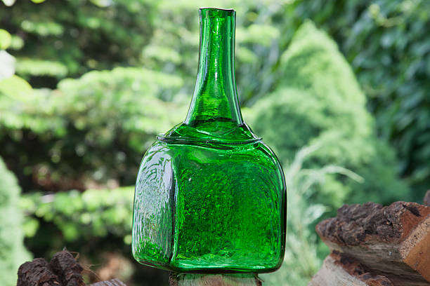 istock Antique square form bottle of green glass 476860836