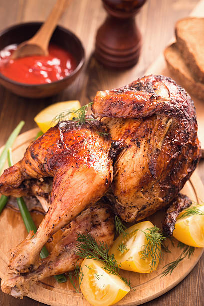 istock Grilled chicken on wooden plate 476863016