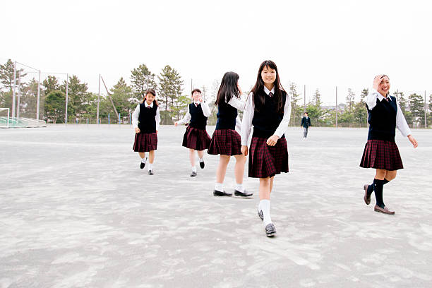 istock Japanese high school. Female students in a school playground 476863536