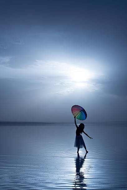 istock Beautiful modern ballet dancer dancing on the lake with tulle 476863736
