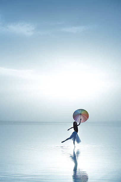istock Beautiful modern ballet dancer dancing on the lake with tulle 476864108