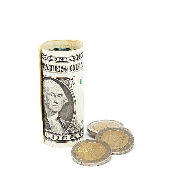istock Dollar banknotes and euro coins on white background. 476864202