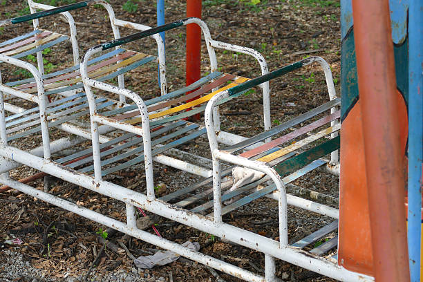 istock old metal seat in kid playground 476864242