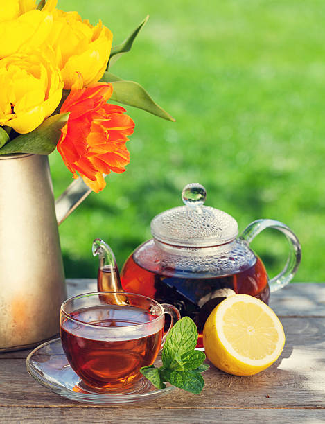 istock Breakfast tea and colorful tulips bouquet 476866960