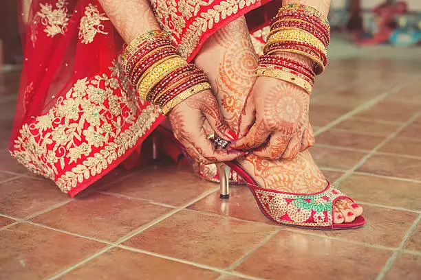 Photo of Henna mehndi wedding design on the feet and hand