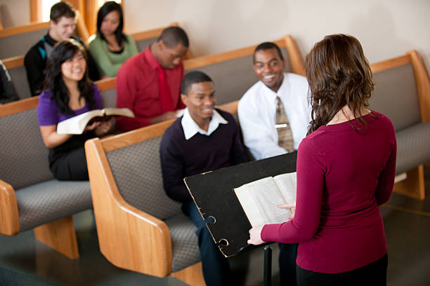 Church Congregation A group of people listening to a sermon in church. black female gospel singers stock pictures, royalty-free photos & images