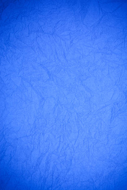 istock Crumpled vintage blue paper textured obsolete background. 476871916