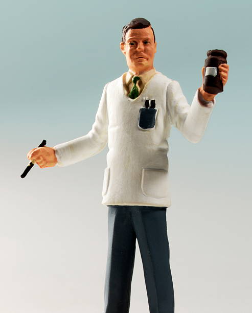 Pharmacists Holding Bottle of Pills