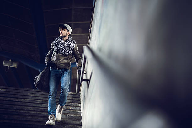 istock Below view of passenger moving down the stairs at station. 476873938