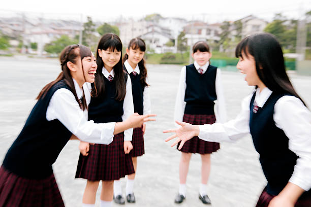 istock Japanese high school. Students exercise outside, playground games, breaktime 476876292
