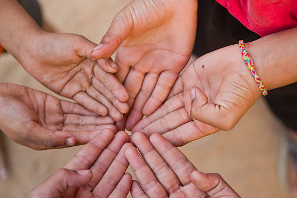 istock Family holding hands together closeup 476880513