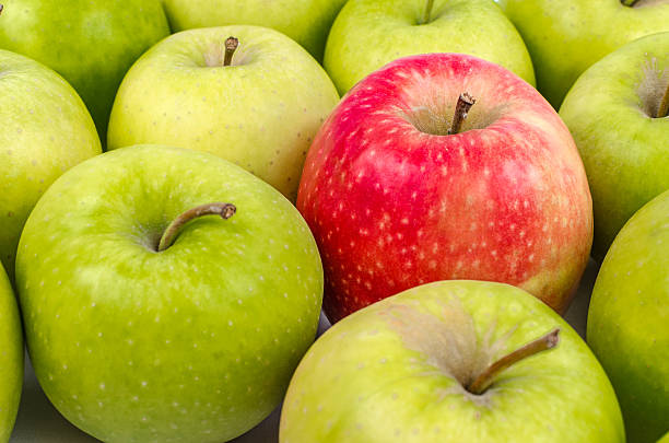 istock Group of Apples on wooden Table 476883306