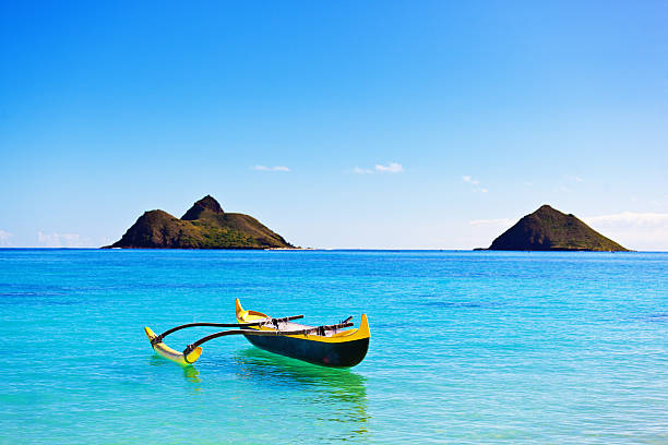 istock Outrigger Canoe off Lanikai Beach with Pacific Islands, Oahu, Hawaii 476884588