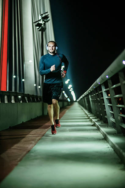 istock running fast late night outdoors 476886626