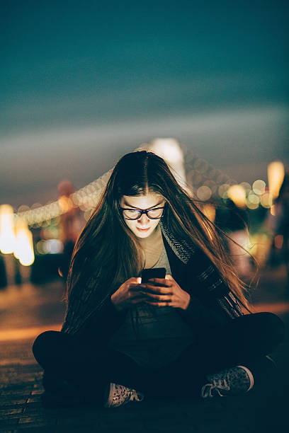 istock Young nerd woman texting on the phone 476889084