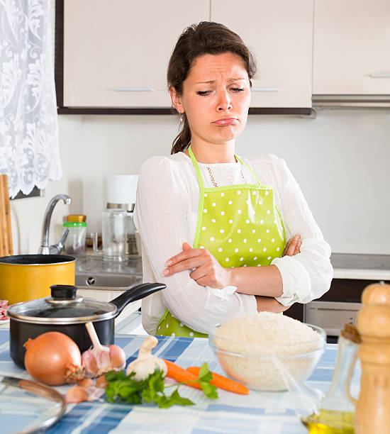 istock Sad housewife cooking dinner 476889916