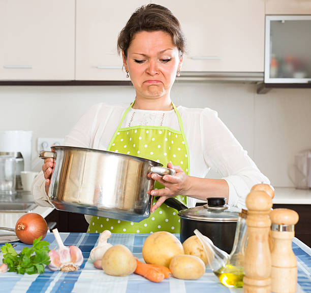 istock Housewife feeling bad smell from pan 476890002