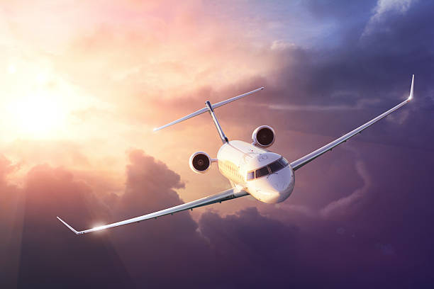 istock Airplane in the sky at sunset 476890155