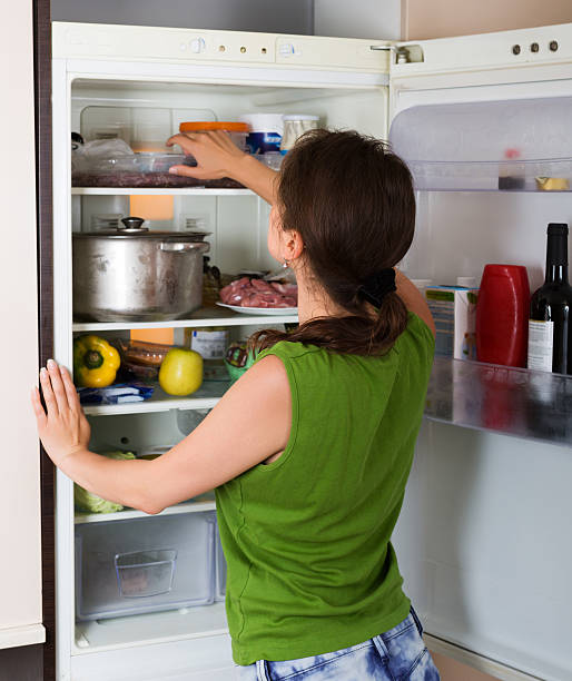 istock Woman looking in fridge 476890370