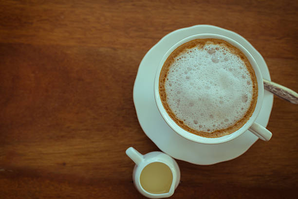 istock hot milk  Latte coffee on wooden table 476892478