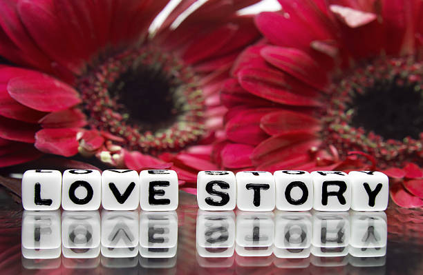 istock Love story with red flowers in background 476894741