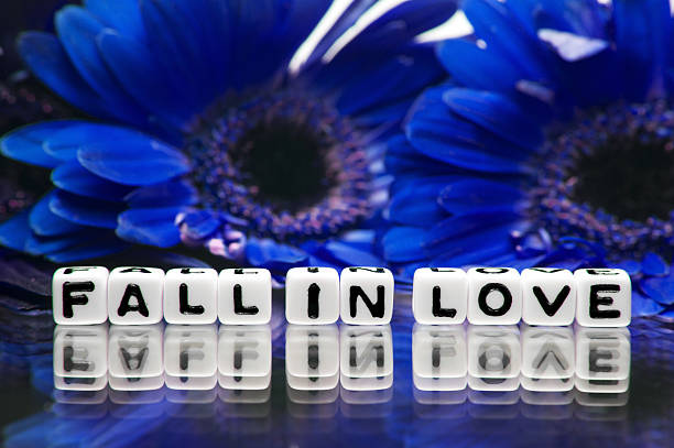 istock Blue theme with fall in love message and flowers 476895799