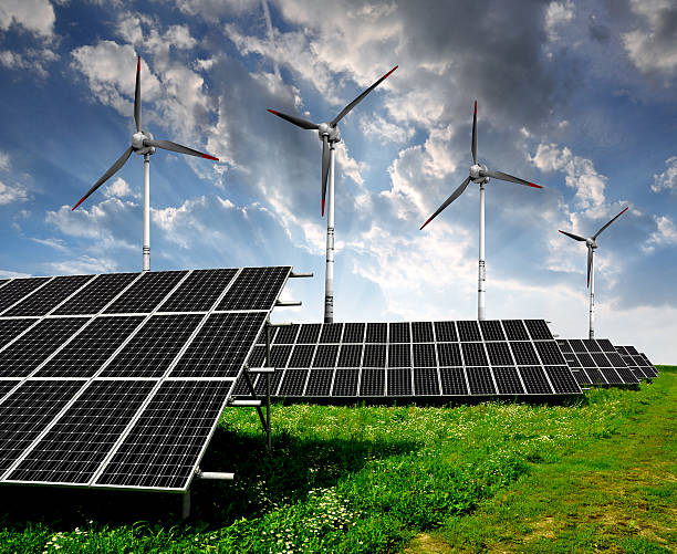 istock solar energy panels and wind turbines 476896629