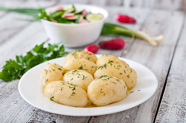 istock Young boiled potatoes with butter and dill 476896820